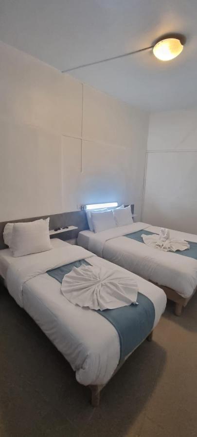 Chambre Triple avec Toilettes Communes